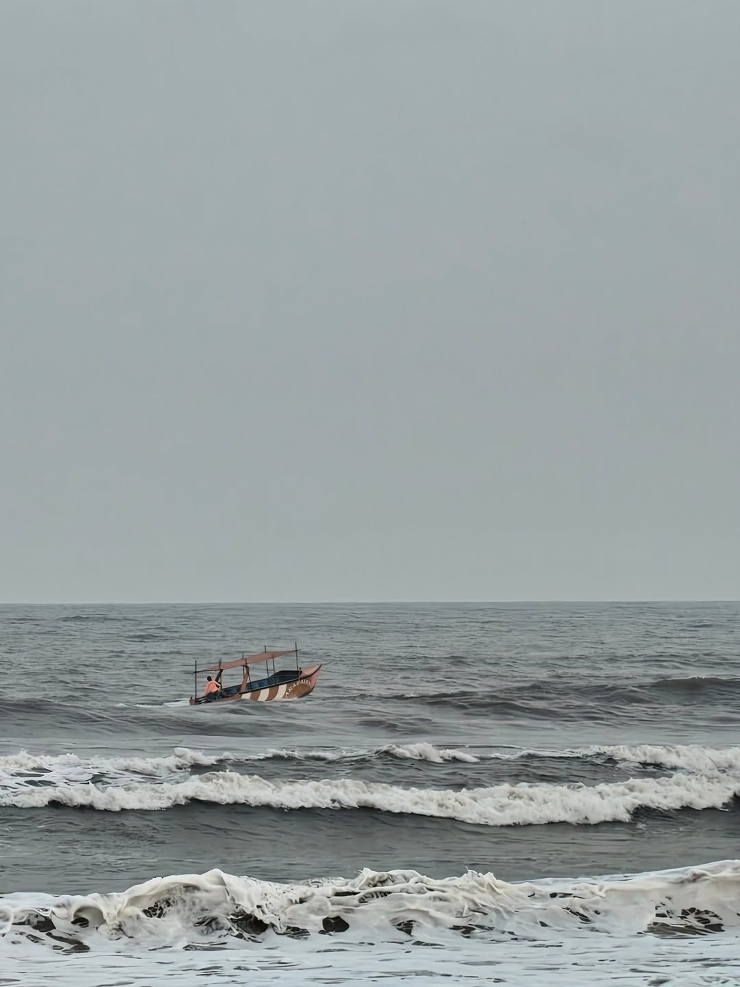The boat out beyond the breakers